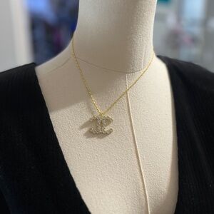 CHANEL Gold Necklace with White Crystal Logo